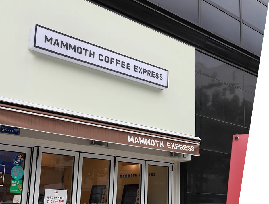 Mammoth Express coffee shop exterior with the red mammoth logo and storefront sign