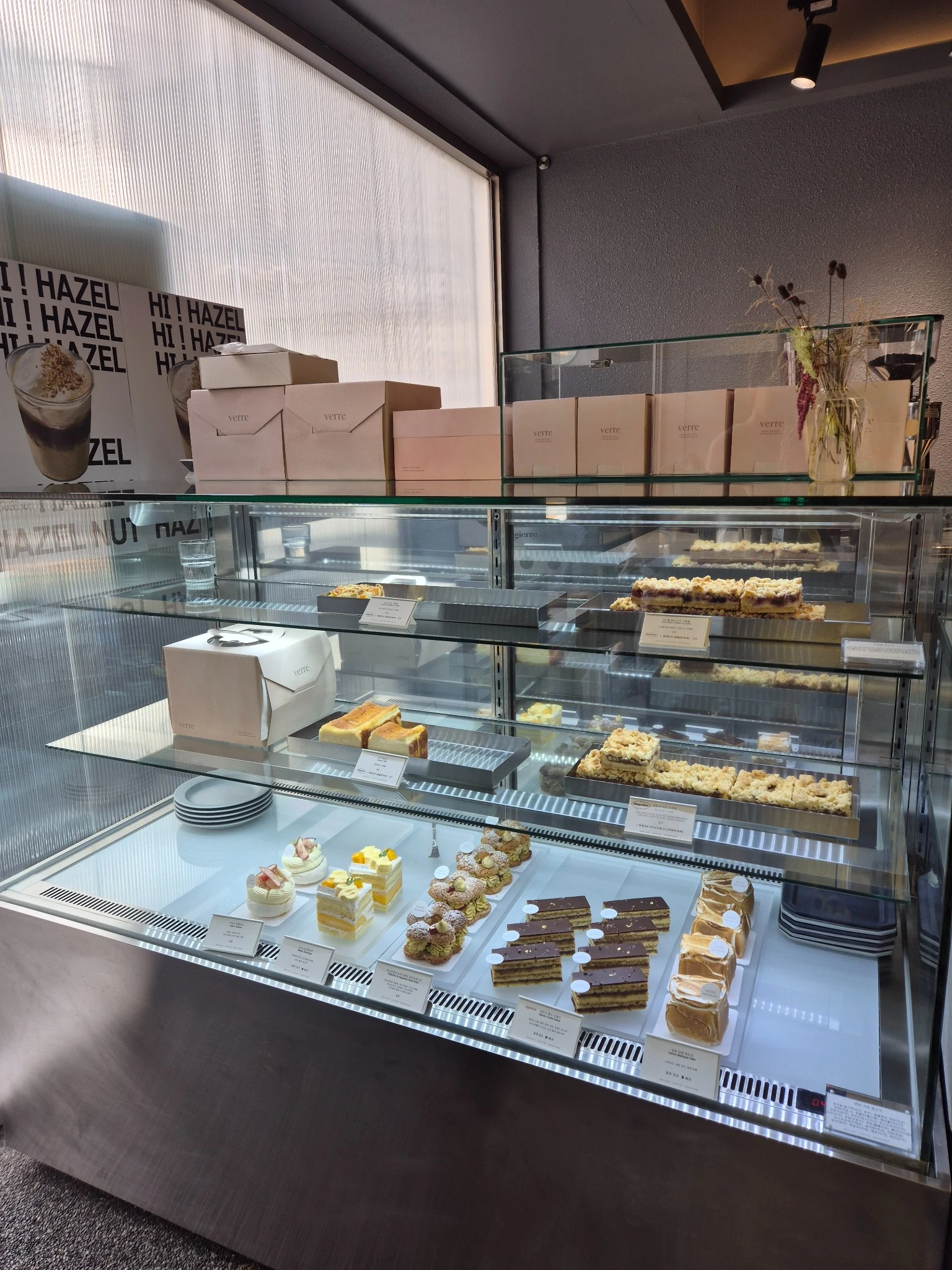 Pastries and cakes displayed inside Reflect Coffee