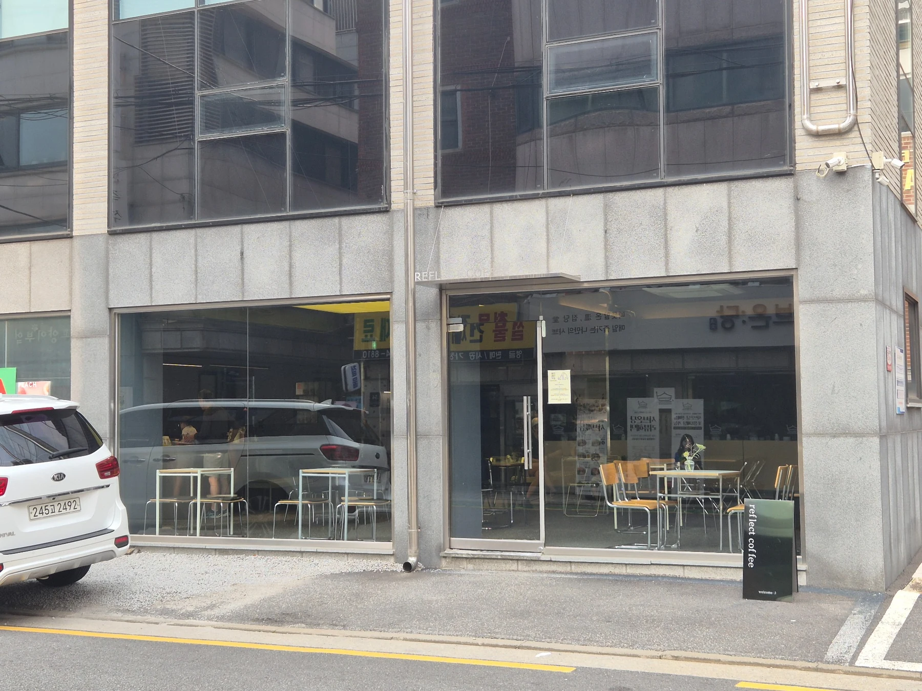 Reflect Coffee storefront on a quiet Seoul side street